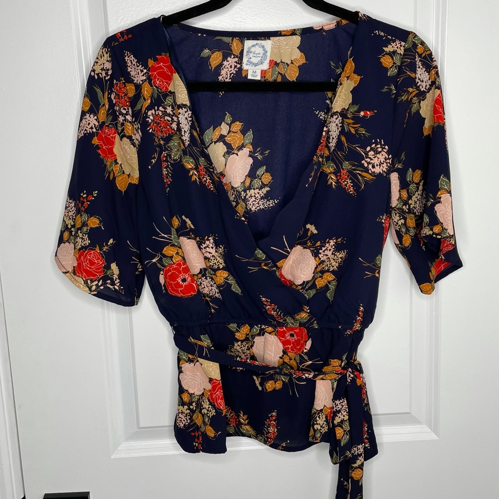 Francesca’s Blue Rain floral wrap top